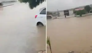 Estrutura de residência parcialmente desabada e rua alagada em Parnaguá, Piauí, após forte temporal.
