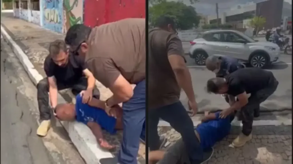 Homem em crise convulsiva sendo socorrido por equipe de segurança e Samu em via pública de Teresina.