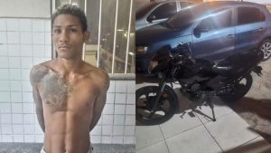 Policial militar conduz Rodrigo Magalhães dos Santos algemado após prisão em São Luís, Maranhão.